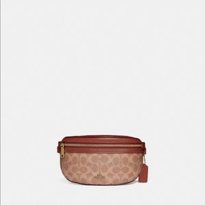 Authentic Coach fanny pack/shoulder purse with original logo design.
